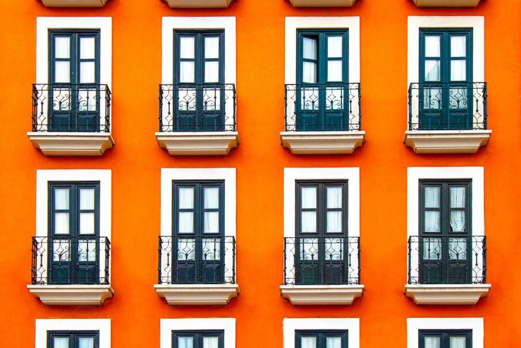 close-up photography of white and orange building during daytime