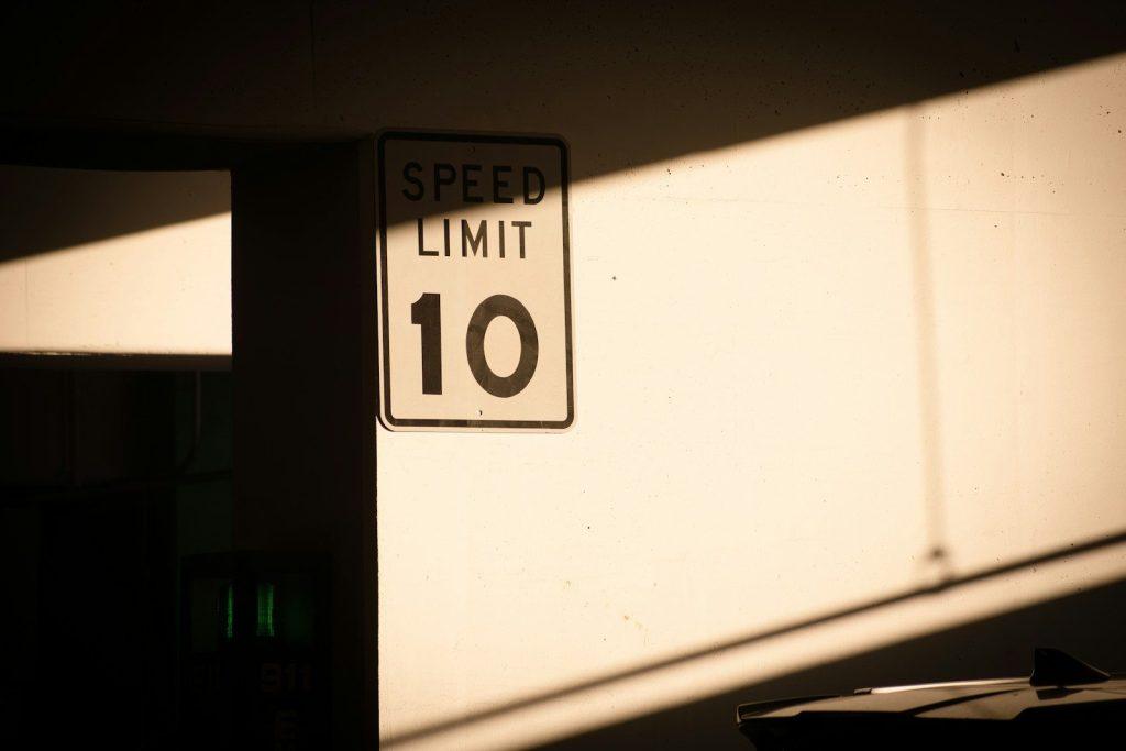 A speed limit sign in a dark room